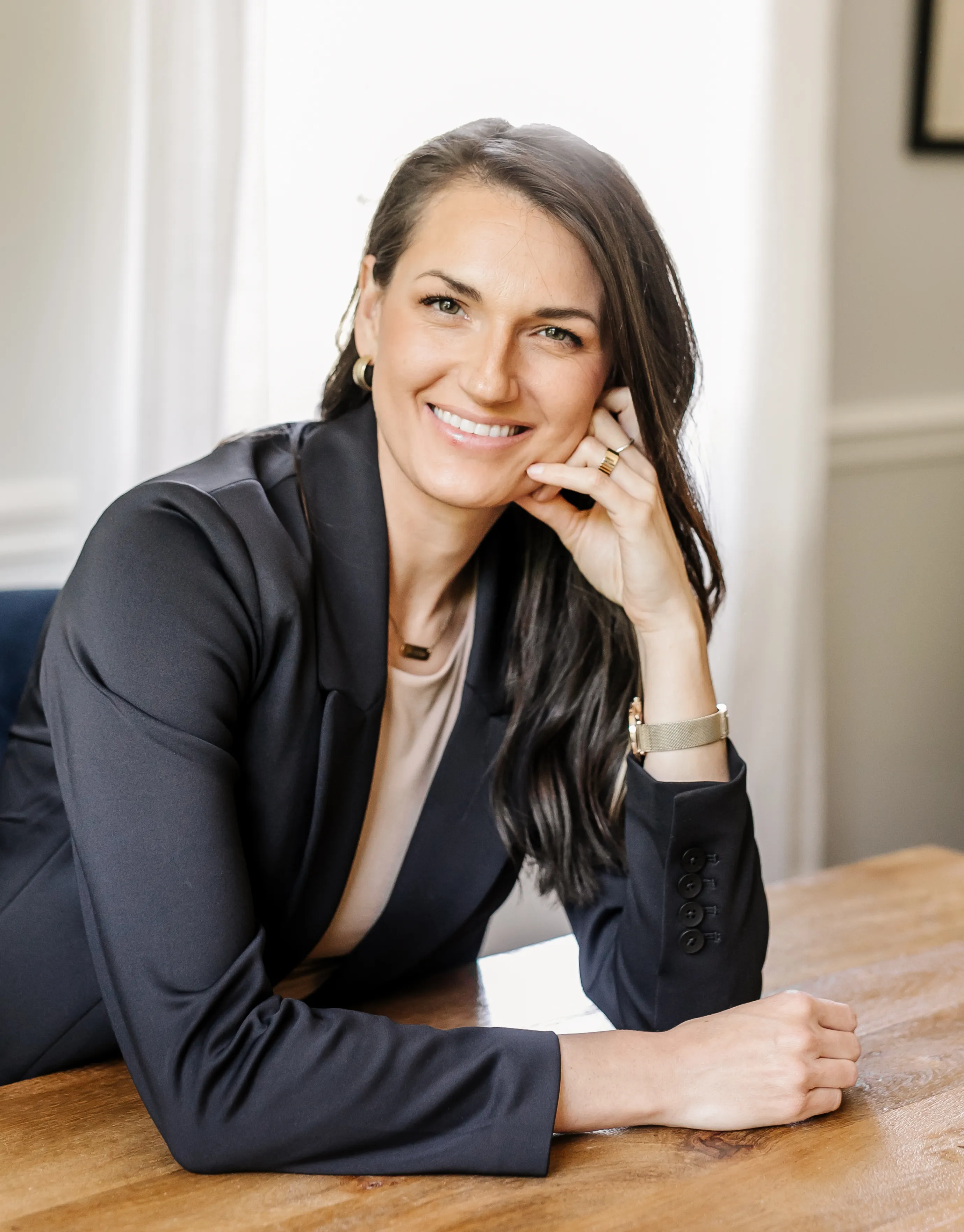 Dr. Abigail Vermeesch with a relaxed, engaged smile at her desk